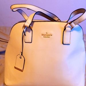 Kate Spade cream colored purse blue white striped lining